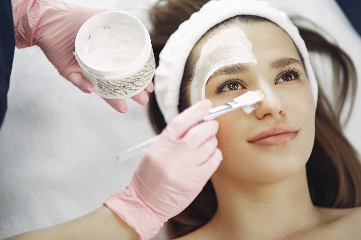 Woman With White Facial Mask